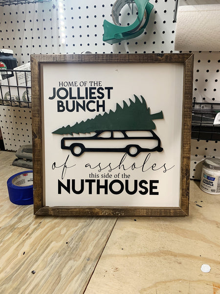 Home of the Jolliest Bunch of Assholes This Side of the Nuthouse Christmas Sign
